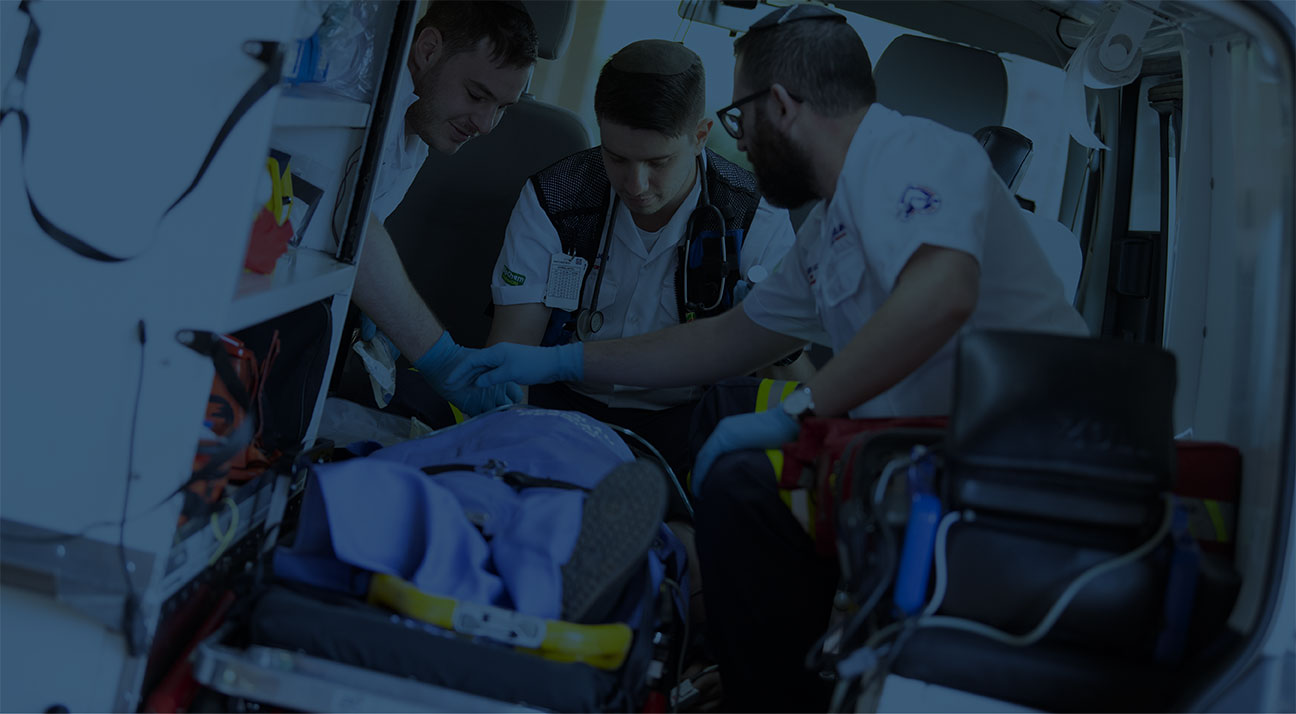 Paramedics working on patient in ambulance